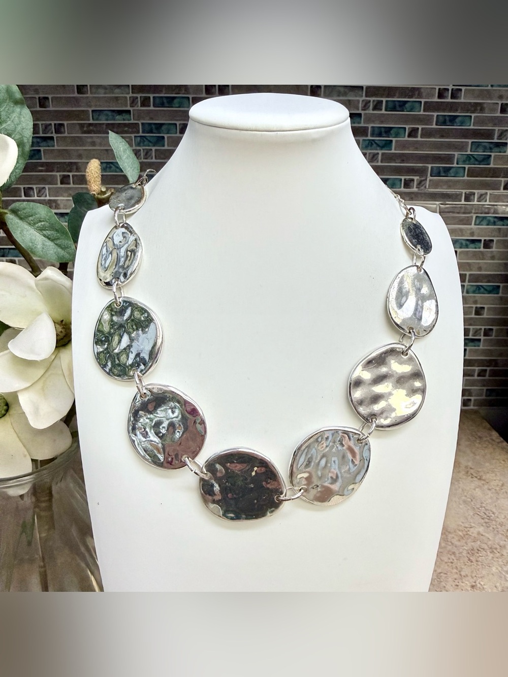 Chico’s eye-catching hammered disc silver-tone statement necklace